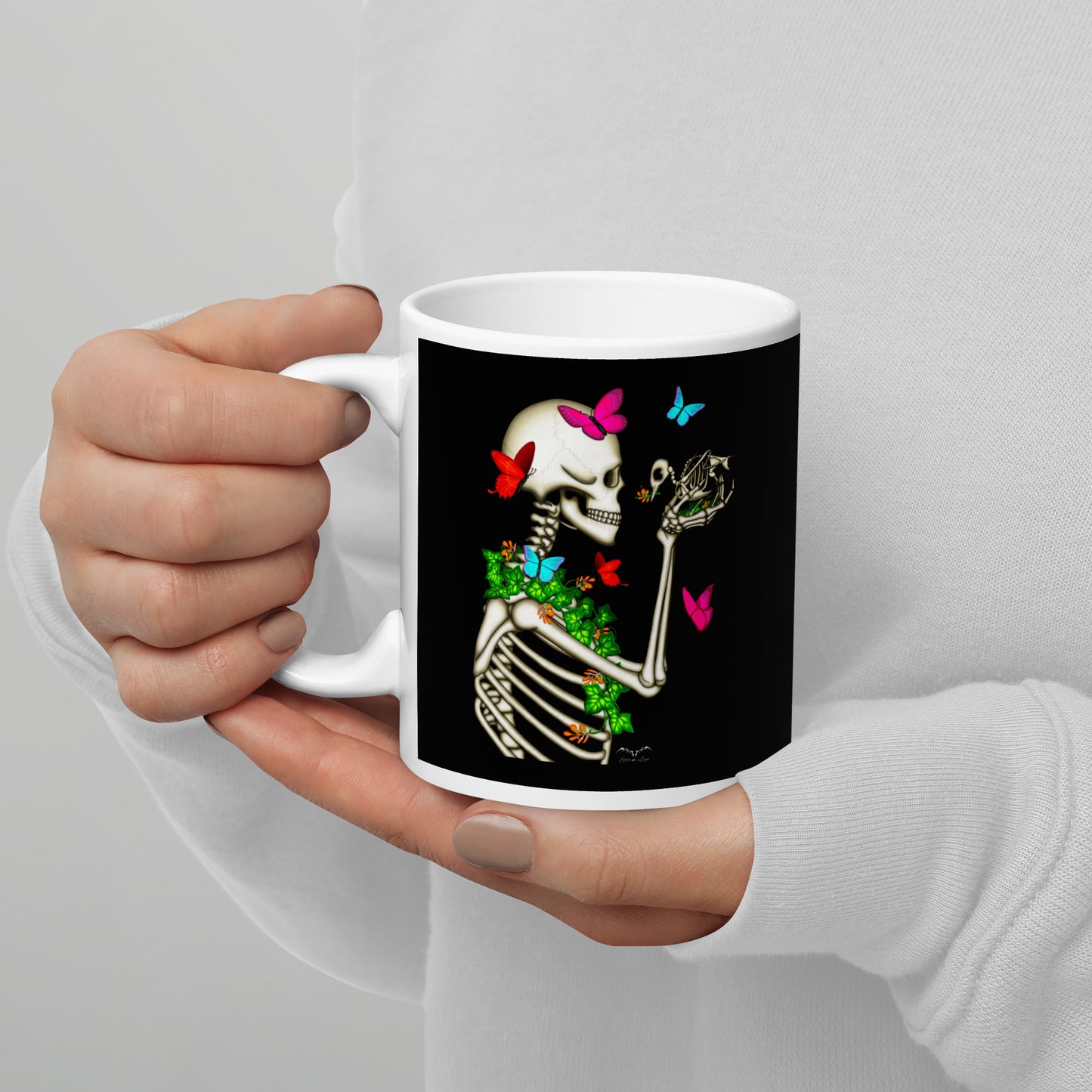 stormseye design skeleton and bird coffee mug black modelled view