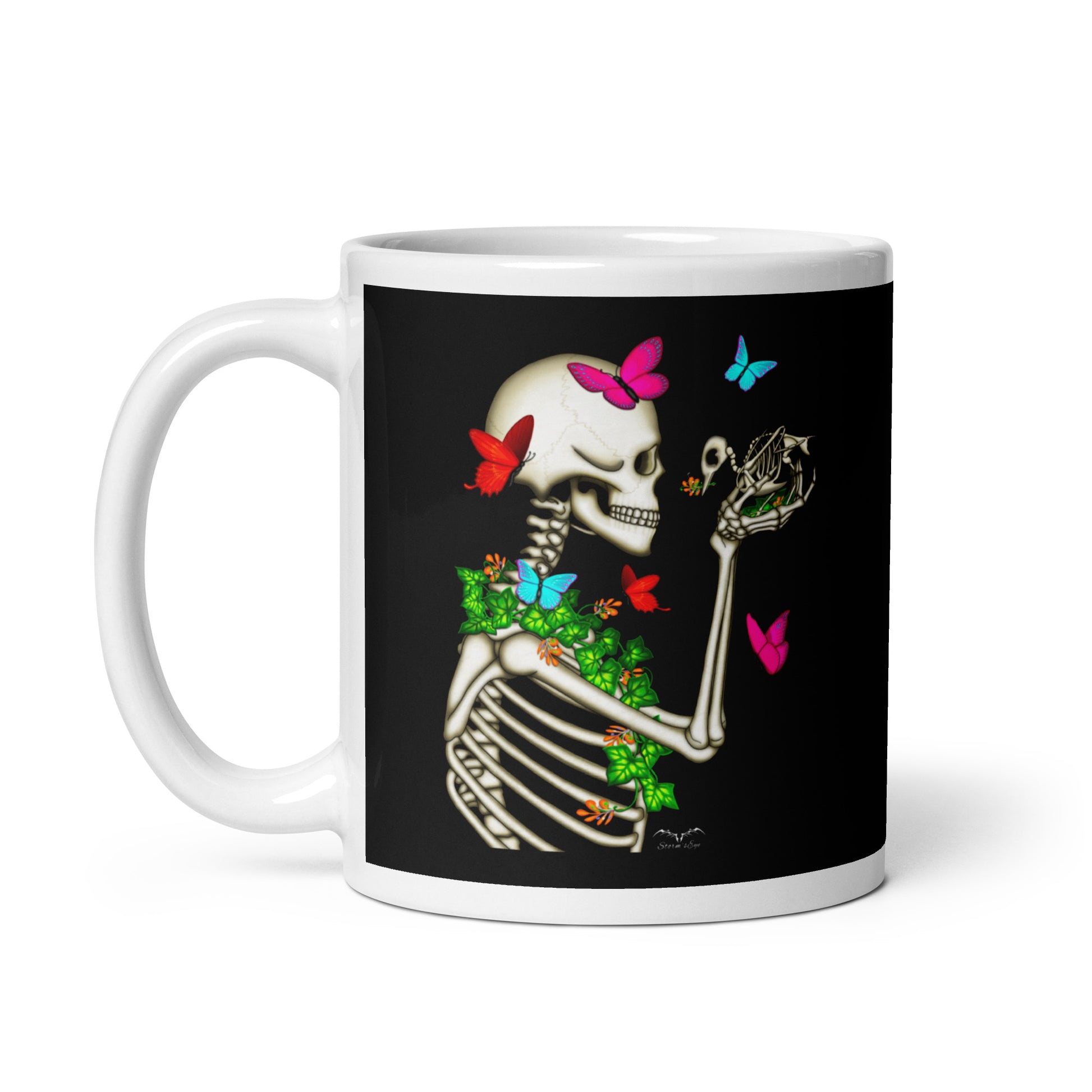 stormseye design skeleton and bird coffee mug black