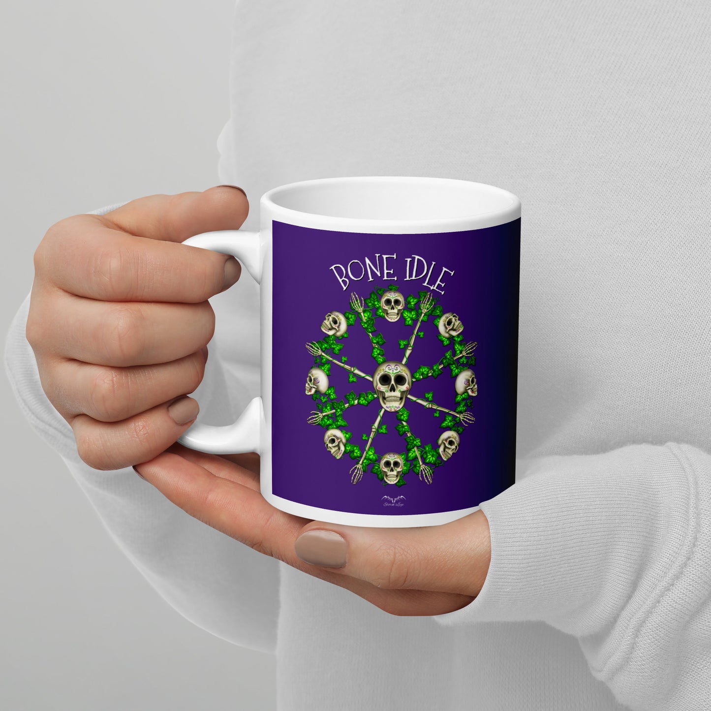 stormseye design bone idle skulls coffee mug purple modelled view