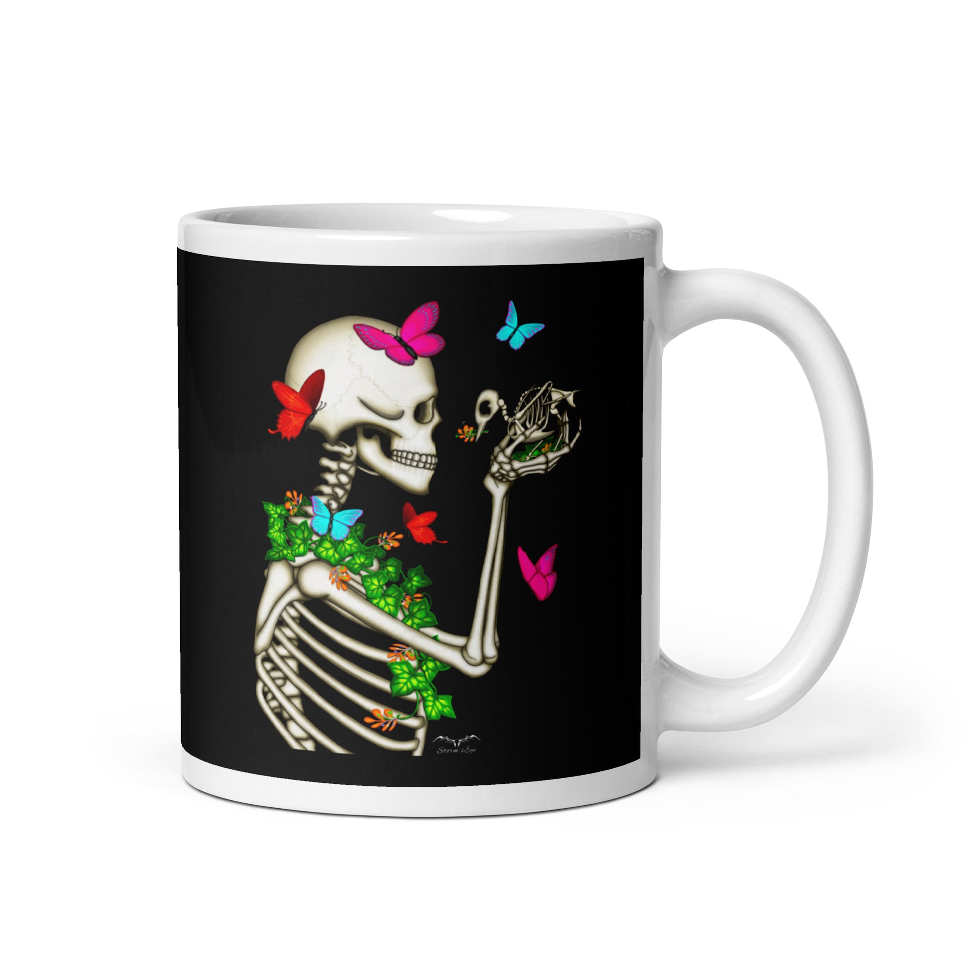 stormseye design skeleton and bird coffee mug black